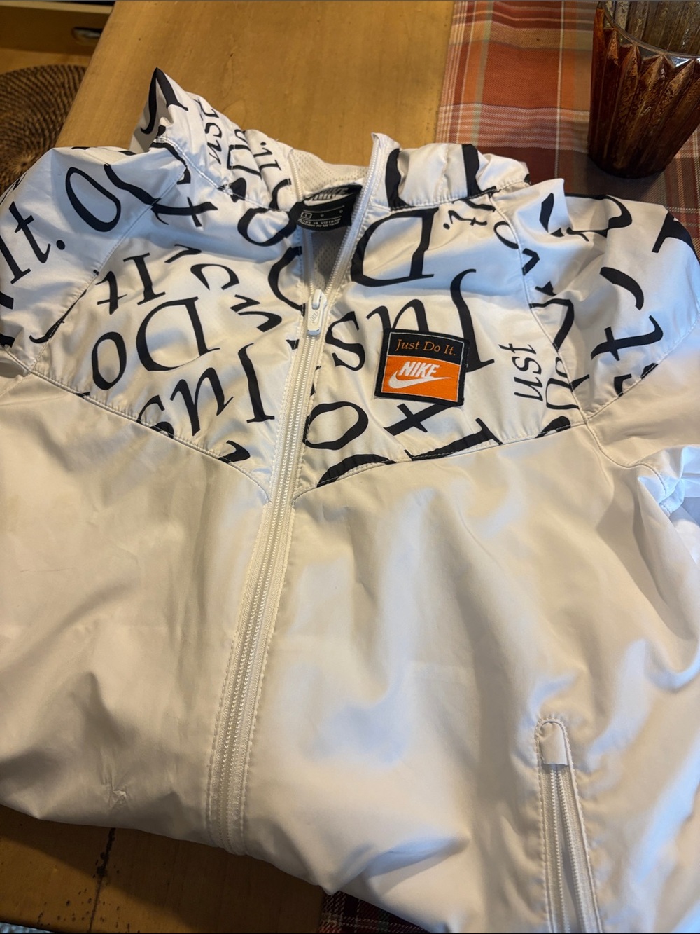 Nike White Kids' Windbreaker with Black Script and Orange Patch